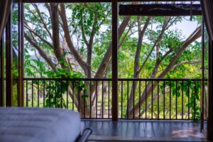 River Kwai House - View from the bed through to the balcony